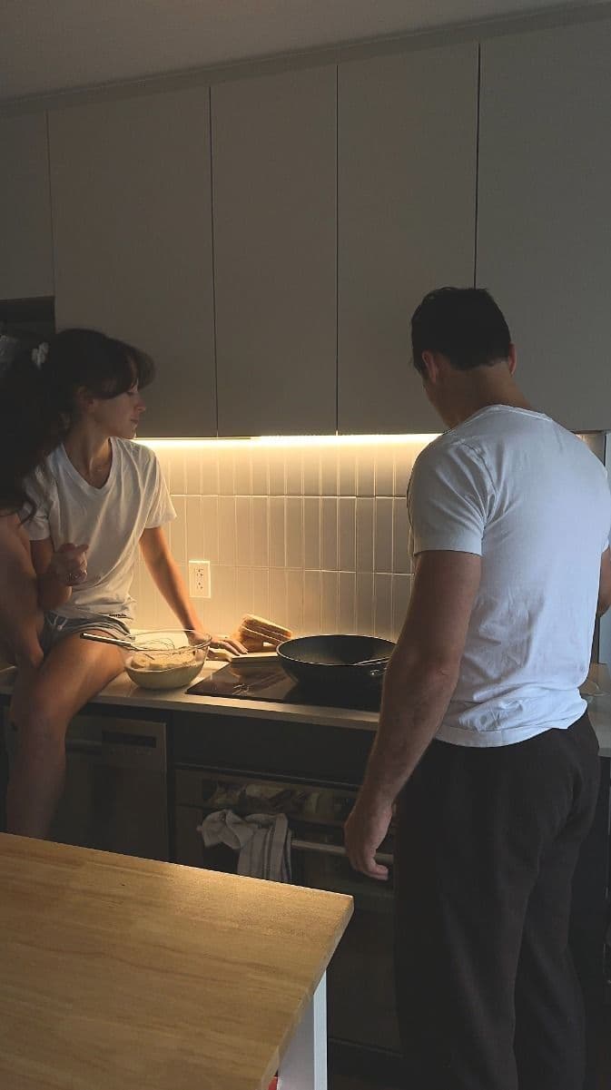 A couple talking together in their kitchen